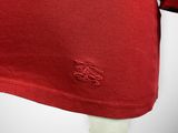 a close up of a red shirt on a mannequin head