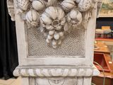 a statue that has a bunch of fruit on it