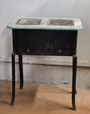 a small table with a stove on top of it
