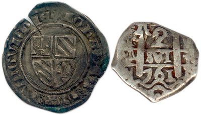 une pièce d'argent sur laquelle figurent une croix et un bouclier au recto