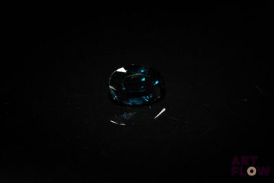 a blue diamond on a black background