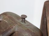 two old rusted metal tanks sitting next to each other