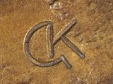 a close up of a coin with a hammer and sickle on it