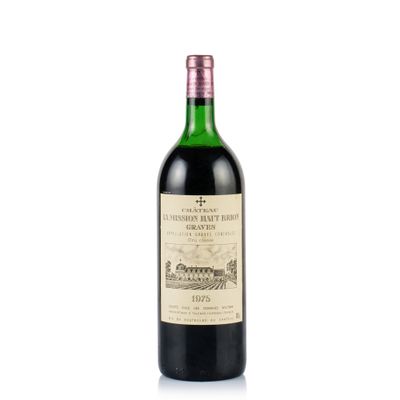 a bottle of wine sitting on top of a white surface