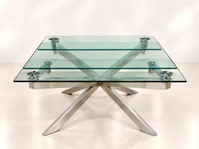 table basse en verre avec des pieds en métal et un plateau en verre