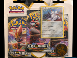 two packs of pokemon cards and a coin are on a table