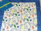 a blue book and a white scarf on a table