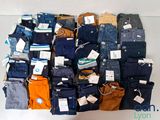 a large pile of men ' s clothing on a table
