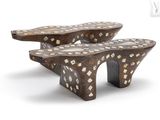 two wooden benches that are sitting on a white surface