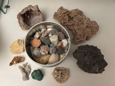 a bowl full of rocks and other rocks on a table