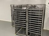 several trays of food sit in a metal rack in a room