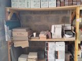 many boxes and boxes on the shelves in the room