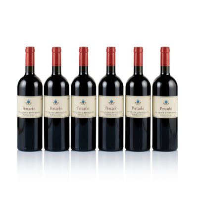 four bottles of red wine are lined up in a row