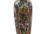 a vase with a gold handle on a white background