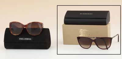 two pairs of sunglasses and a case on a white surface