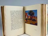 an open book with a picture of a group of people on it