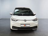 the front of a white volkswagen e - golf parked in a room