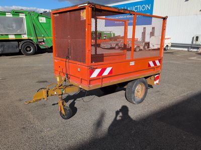 an image of a small orange work vehicle