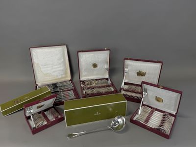 several silver spoons and spoon rest in a case on a table