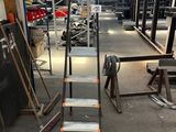 an image of a metal ladder in a warehouse