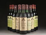 several bottles of wine are lined up in a row