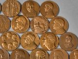 a lot of coins that are laying on a table