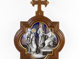 a wooden cross with a picture of jesus and other people