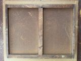 a picture of an old window with a screen in it