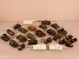 a lot of toy army vehicles on a table
