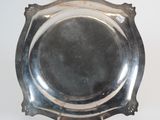 an antique silver plate on a white background with a white background