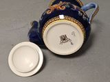 a cup and saucer sitting on a table