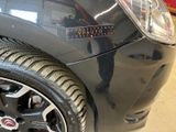a close up of a car with a sticker on it
