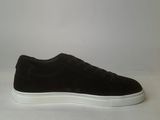 men ' s black sued sneakers with white soles on a white surface