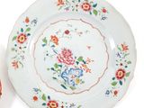 three plates with different designs on them on a table
