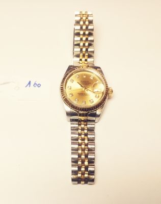 a watch that is sitting on a white surface