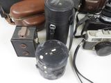 many different types of cameras on the table
