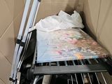 a small bed in a cardboard box with a ladder in it