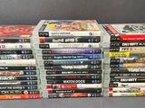 many dvds stacked on top of each other on a table