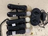 four black and white electrical tools on a white surface