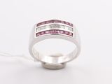 a close up of a pink sapphire and diamond ring on a white background