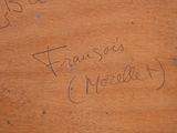 a piece of wood with writing on it