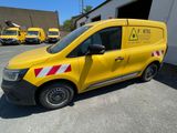 a yellow van parked in front of a building