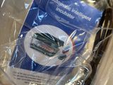 a plastic bag with a cell phone inside of it