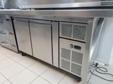 a large stainless steel kitchen with a lot of appliances