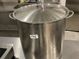 a large pot sitting on top of a stove in a kitchen