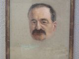 portrait d'un homme portant une moustache et une barbiche, dans un cadre en bois