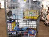 a metal cart with many items in it in a warehouse