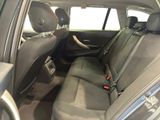 the back seats of a car with a steering wheel in it