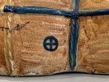 a small wooden box that has a cross on it