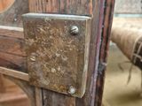 a close up of a wooden door with a latch on it